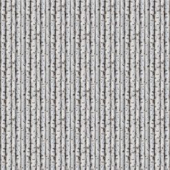 This is a picture of lined birch tree trunks on gray fabric