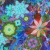 Picture of bold, bright flowers in jewel tones on blue fabric