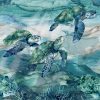 Picture of sea turtles on blue green fabric