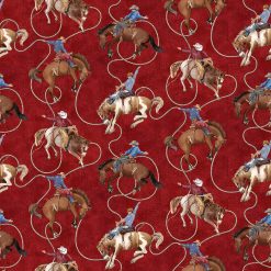 Cowboy Blues fabric with cowboys on horses with a red background