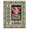 “A Highland Christmas Quilt Kit – holiday quilt featuring Highland cow in Santa hat, plaid borders, evergreen garland – finishes 48×59 – uses Highland Heart fabrics by Northcott – Lightning Bugs Quilt Studio”